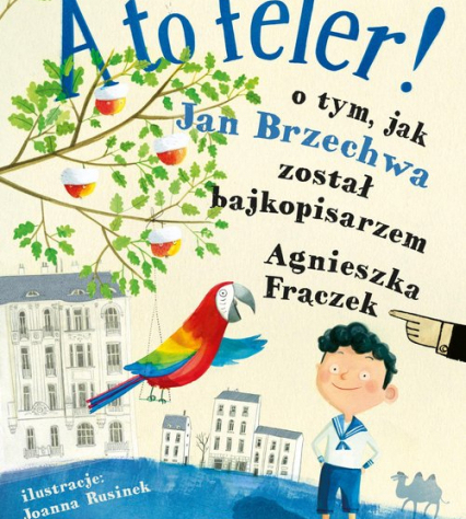 okładka książki A to feler! Na której widać chłopca, papugę, drzewo i bloki