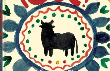 Namalowany czarny byk w kole wśród kwiatów